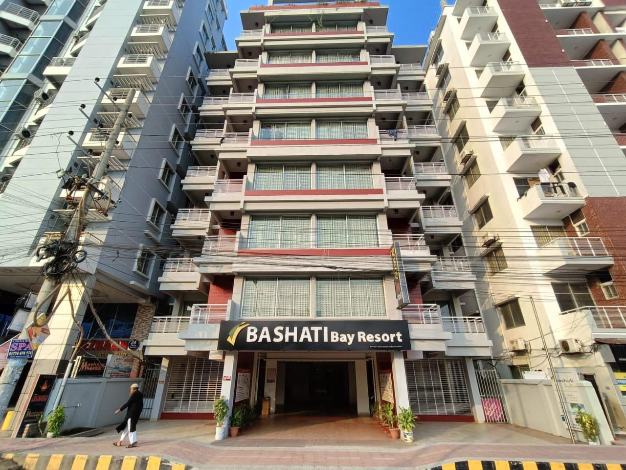 Exterior View of Bashati Bay Resort Front view of Bashati Bay Resort building with balconies and signage.